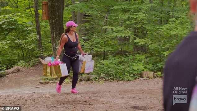 Gift bags: Teresa then walked up to the women in the woods carrying gift bags