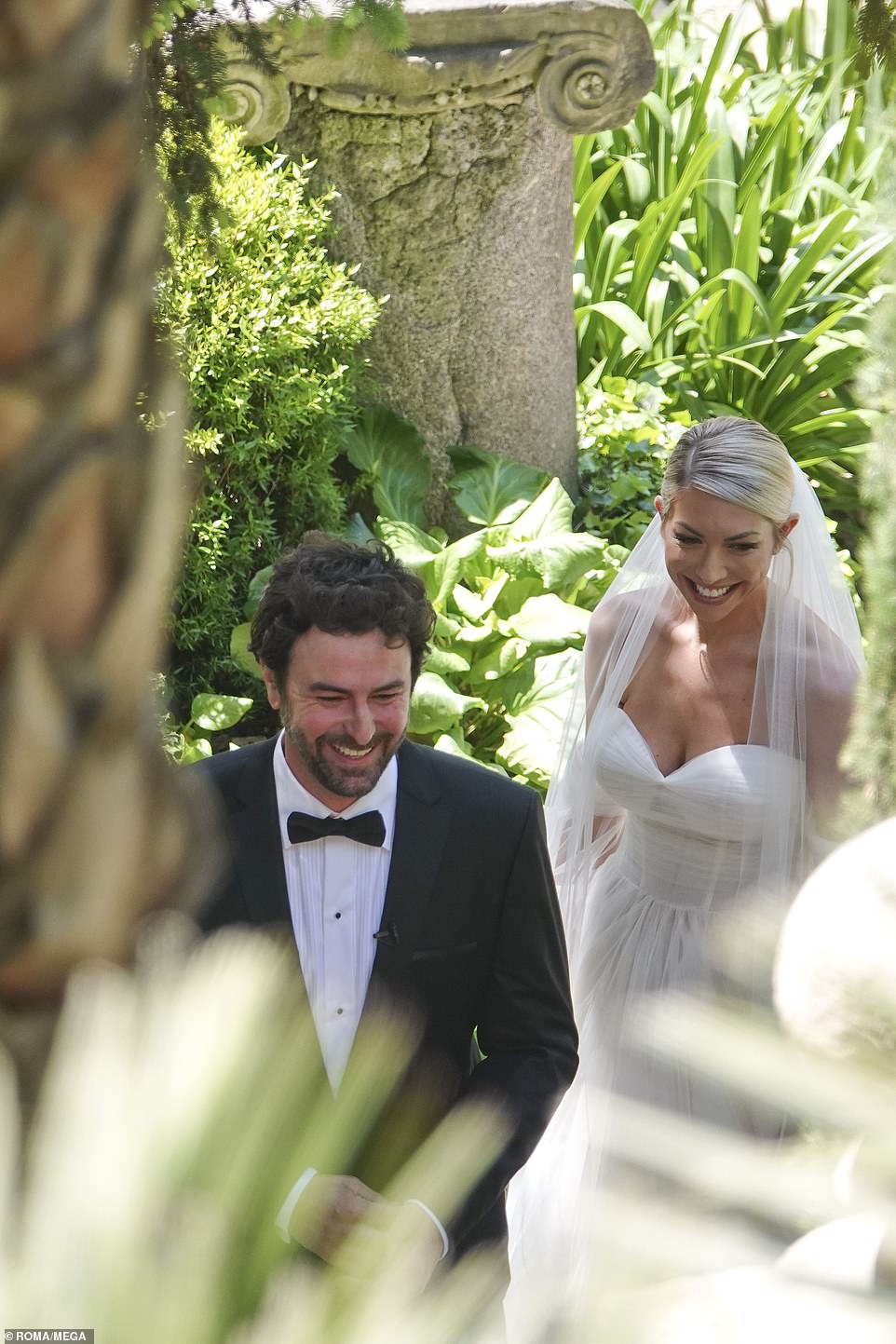 After they said 'I do': The bride and groom beamed with joy as they greeted their friends after they said their vows