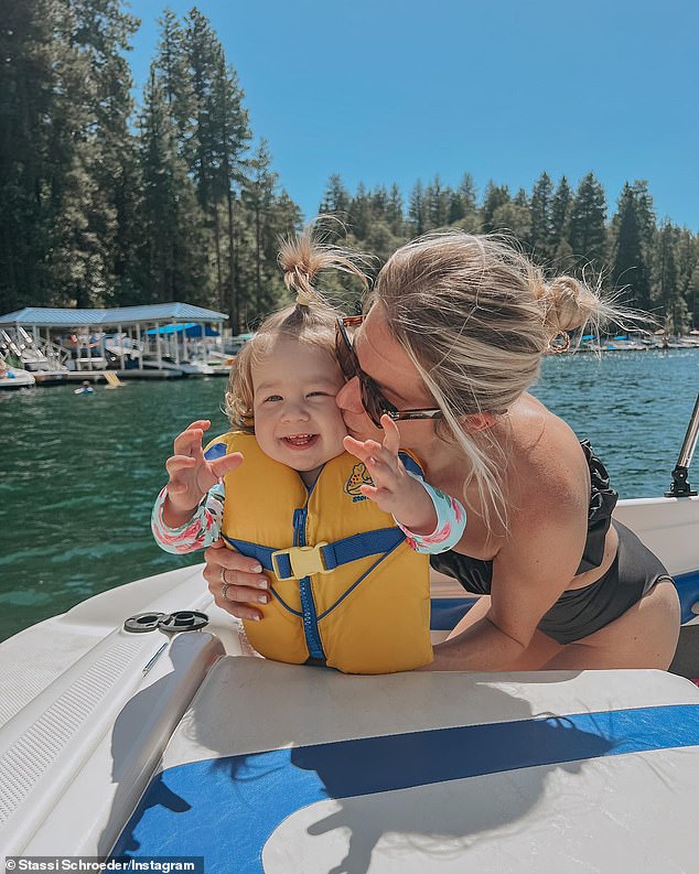 Fit mom: The podcast host showed off her slender figure in a strapless black one-piece Zara swimsuit that featured side cut outs