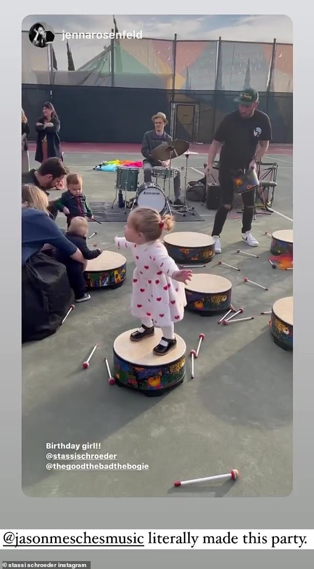 Bouncing to beat of her own drum: The birthday girl showed off her love of music during a drum-off with other kids and parents