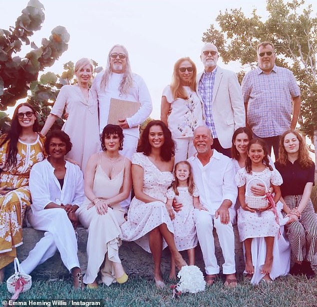 Sticking together: The blended family is definitely close as they have documented their time together even quarantining during the height of the COVID-19 pandemic together and supporting Bruce through his battle with dementia; the family are pictured at Emma and Bruce's vowel renewal ceremony in 2019 to celebrate their 10th anniversary at the time