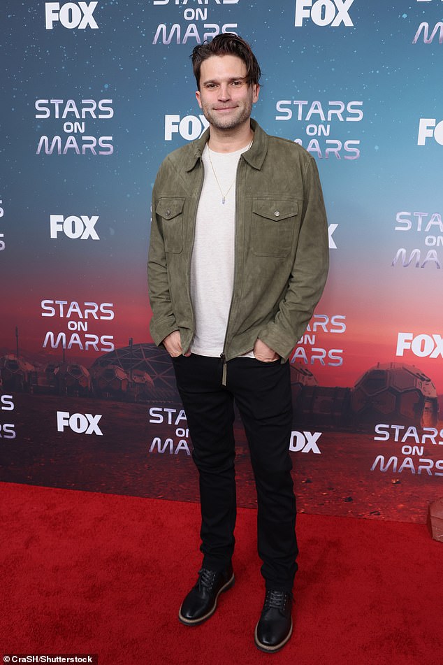 All smiles: Tom Schwartz hits the red carpet, completing his look in black boots