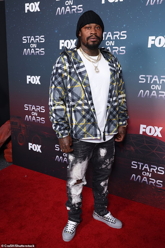 Marshawn: Former NFL superstar Marshawn Lynch also hit the red carpet in a white t-shirt, black and grey plaid shirt with black and white pants and black plaid sneakers