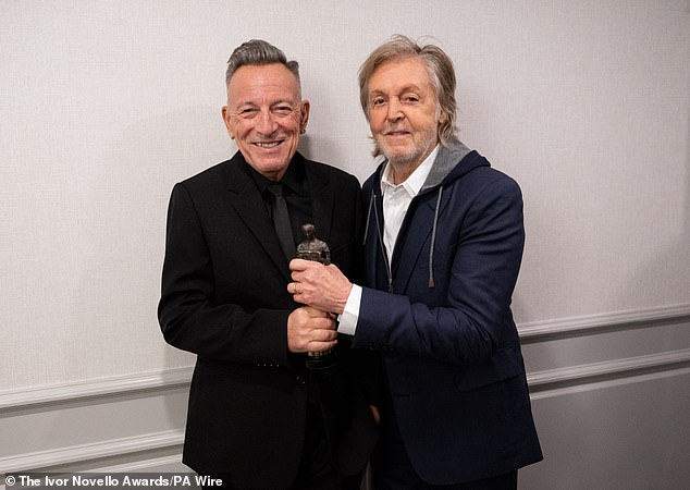 Bruce Springsteen appeared in high spirits on Thursday evening as he was presented the Academy Fellowship Award by pal Sir Paul McCartney at the star-studded Ivor Novello Awards