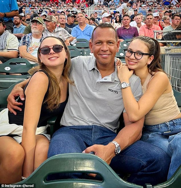 Rodriguez is seen with his daughters at a Minnesota Twins game last summer