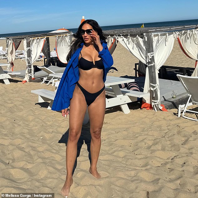 Melissa Gorga posed in a tiny black bikini from Envy by MG while in The Hamptons this weekend