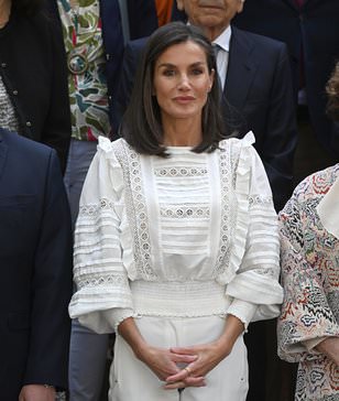 Queen Letizia of Spain wows in white ensemble as she carries out a solo trip in Madrid -