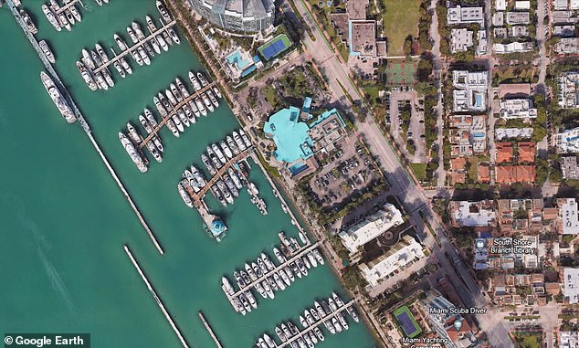 The Houston-born rapper - who has two young children, Stormi and Aire, with Kylie Jenner - was arrested by police at the Miami Beach Marina (pictured from above)