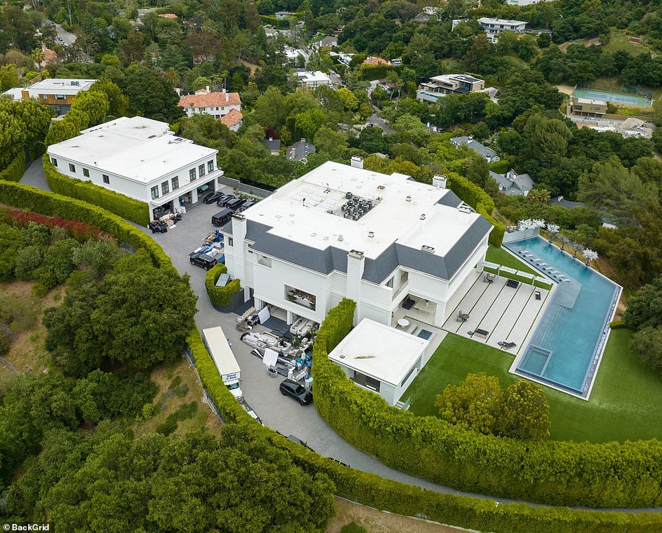 In the summer of 2023 the couple handed over $60.85 million for the 46,000 square-foot mansion, according to TMZ . The deal took just one week and the pair paid nearly $15 million under the $75 million asking price. The home sits on a 5-acre promontory and boasts 12 bedrooms and 24 bathrooms. The listing reveals that it was 'newly rebuilt and expanded' and features a 12-car garage and parking for 80. There is also a 'one-of-a-kind' indoor sports complex, a 5,000 square-foot guest penthouse, a caretaker house and a two-bedroom guard house on the grounds.