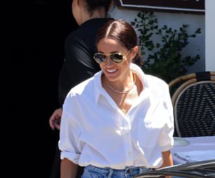 Meghan Markle dons a crisp white £245 shirt and £12,800 Cartier necklace as she steps out