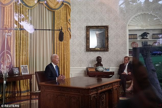 President Joe Biden delivers remarks from the Oval Office about his canceled campaign. His son, Hunter Biden, sits in a chair just out of the camera's shot