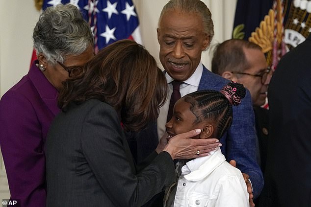 Vice President Kamala Harris talks with Gianna Floyd, the daughter of George Floyd,