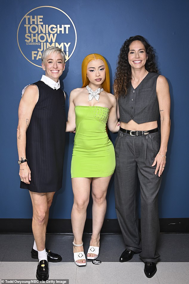 She also showed off her figure in a lime green sleeveless dress while posing backstage at the Jimmy Fallon show; pictured with Megan Rapinoe and Sue Bird on July 26