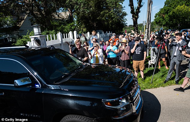 Supporters lined-up outside Walz's residence in St. Paul on Tuesday and swarmed his vehicle as it left to transport the governor to the airport for his first campaign stop as VP in Pennsylvania