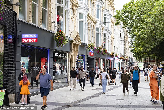 Shoppers walking along Queen Street in Cardiff