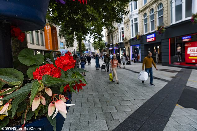 Boxes of flowers in the centre of Queen Street in Cardiff which has been voted the best high street in Britain