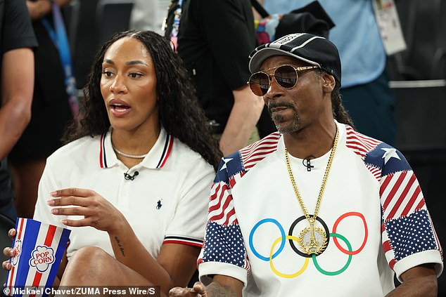 The duo sat courtside draped in USA colors for the quarterfinal matchup