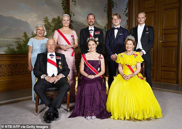 Norway's Princess Ingrid Alexandra (front C) poses for a family photo with (front L and R) Norway's King Harald V and Norway's Queen Sonja and (back LtoR) Marit Tjessem, Norway's Crown Princess Mette-Marit, Norway's Crown Prince Haakon, Norway's Prince Sverre Magnus and Marius Borg Hoiby on the occasion of a gala dinner for her 18th birthday in Oslo in 2022