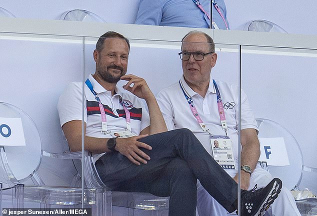 Despite controversy at home, the Crown Prince smiled as he was pictured watching events with Prince Albert of Monaco