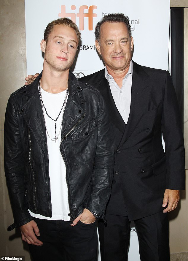 The rapper is the son of Hollywood stars Tom Hanks and Rita Wilson (pictured in 2012)