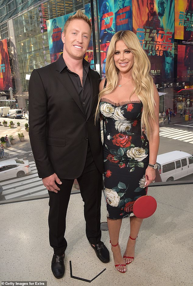 Kim Zolciak and Kroy Biermann have slashed the price on their Georgia mansion once again as they battle to sell the home amid their money woes and divorce battle - pictured 2017