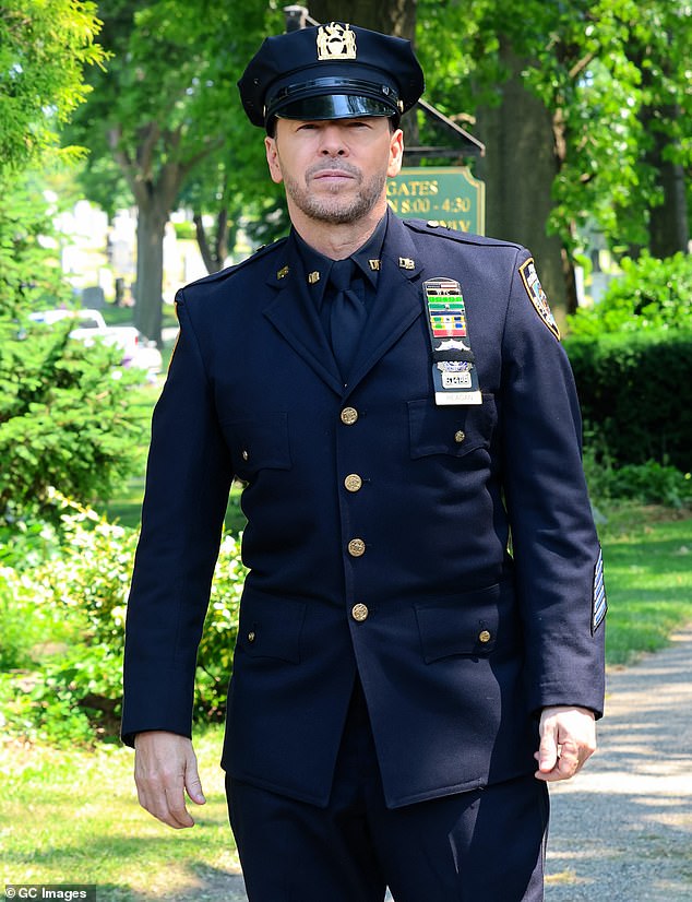 Blue Bloods star Donnie Wahlberg has cryptically hinted at future plans for the TV franchise - despite having filmed its 'apparent final season'; pictured shooting the show this June