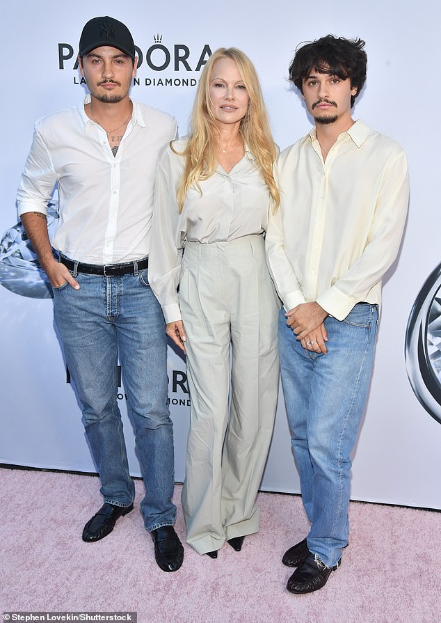 Pamela Anderson is revealing how her now-adult sons Brandon Thomas Lee (L) and Dylan Jagger Lee (R) were exposed to uncomfortable aspects of her wild life in a new Better Homes & Gardens cover story; pictured in September in NYC