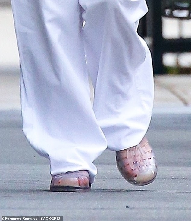 Lawrence was spotted strolling the sidewalk in a pair of clear jelly shoes