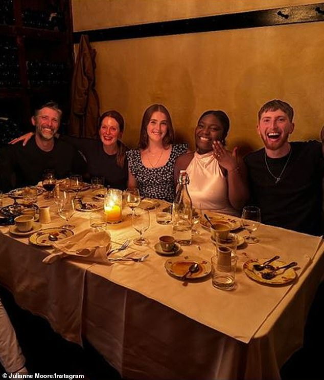 Julianne Moore (2-L) and her second husband Bart Freundlich (L) hosted an engagement dinner for their son Caleb Moore Freundlich (R) and his fiancée Kibriyaá Morgan (2-R) at a wine-filled New York City restaurant on Tuesday night