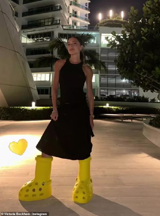 He followed in the footsteps of his mum after Victoria ditched her signature heels to pose in the same yellow cartoonish oversized boots last year