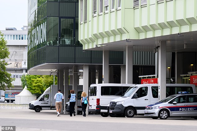 Police vehicles and security teams are seen outside of the Ernst Happel stadium this morning