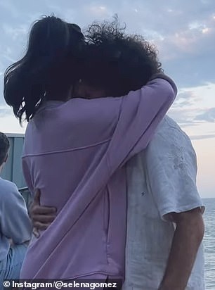 In one of the images and video, the happy couple cuddled up over a picturesque sunset view by the ocean as Benny cheekily placed his hand on her backside