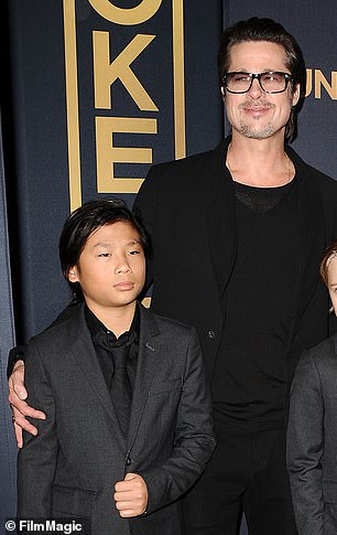 Brad Pitt, 60, is 'distraught' after his 20-year-old estranged son Pax Jolie-Pitt (seen together in 2014) crashed his scooter into a car