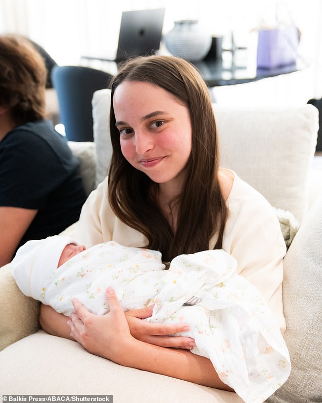 Princess Salma Bint Abdullah (daughter of King Abdullah and Queen Rania) holding her first niece, Princess Iman (Bint Al Hussein), born to her brother Crown Prince Hussein (or Al Hussain), and Princess Rajwa