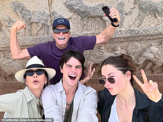 Earlier this year, Michael joked that he and his wife bribe their adult children with 'lavish' trips to get in family time (seen in India)