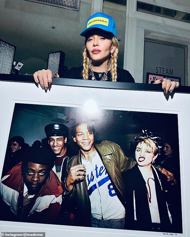 Madonna was in a celebratory mood on Thursday when she posed with one of her birthday presents more than a week before she turns 66