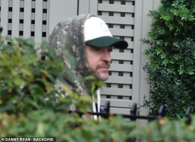 Justin Timberlake and his wife Jessica Biel appeared tense as they reunited ahead of his show in Manchester - following DailyMail.com's embarrassing report that shed more light on his DWI