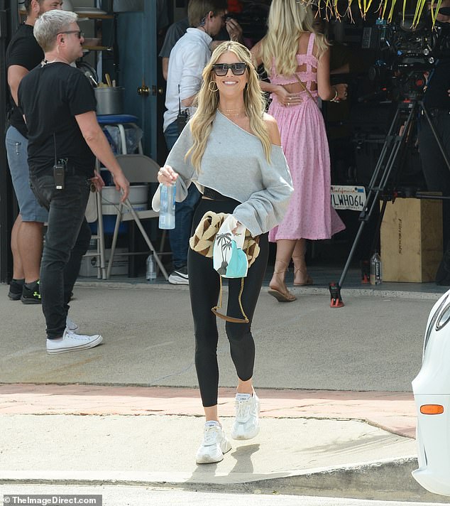 Christina Hall was seen for the first time on set of her reality series after divorce news from husband and co-star Josh Hall as she got back to work on set of The Flip Off in San Clemente, California on Wednesday