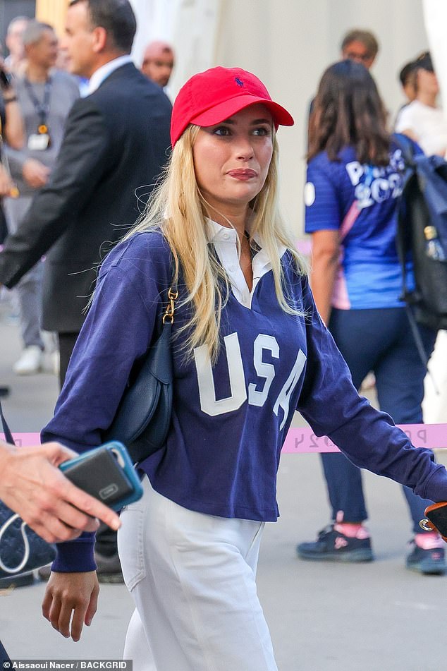 The Scream Queen appeared to be with a lady friend as she made her way inside the arena and then sat down together to watch the basketball game