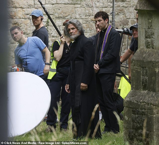 The case were surrounded by the cameramen as they filmed the shots at the church