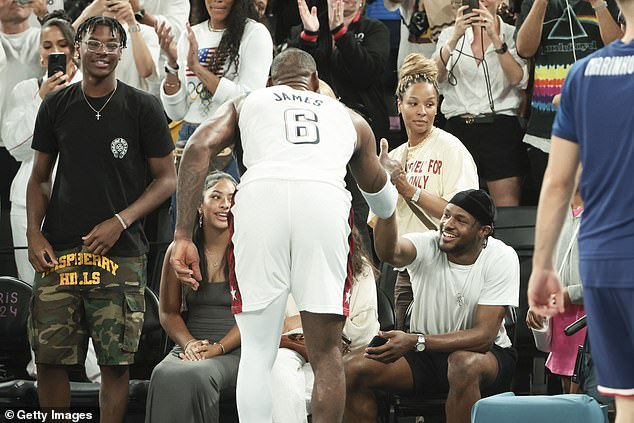 The James clan was all smiles when LeBron celebrated his team's victory with them