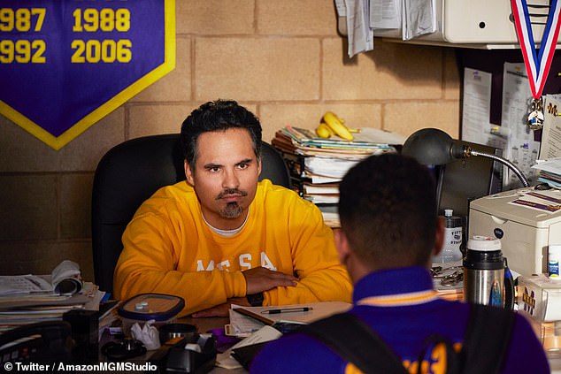 Michael Peña plays Robles'  high school wrestling coach Bobby Williams