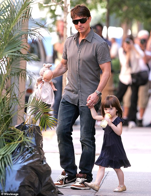 Dad Cruise seen with a very young Suri on the streets of Manhattan in 2008 when he was still wed to Holmes