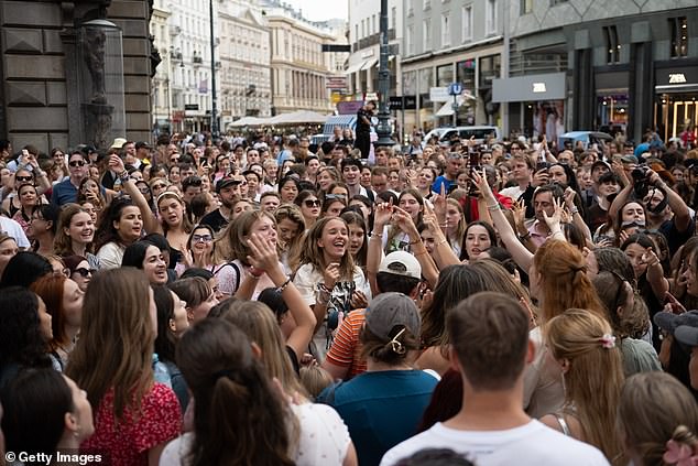 Taylor Swift fans have sparked safety concerns after gathering in a large group to sing her songs following the cancelation of her Eras Tour concerts due to a terrorist threat