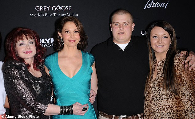 Kelley(pictured right in 2013)  is the daughter of Wynonna and her first husband, Arch Kelley III - who she was wed to from 1996-1998 - seen with Naomi Judd, Ashley Judd and Elijah Kelley