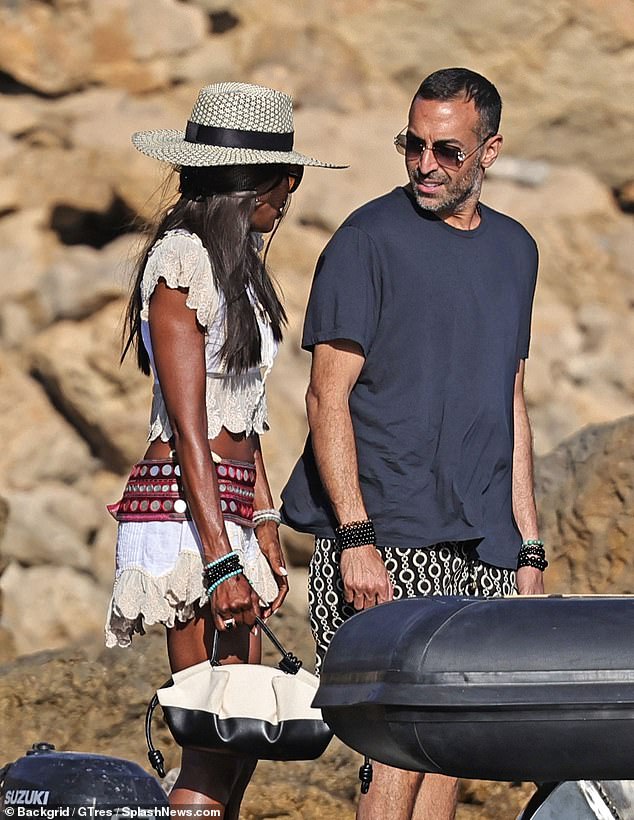 Carrying her essentials in a fashionable black and white leather handbag, the star completed the look with some black shades and a sunhat