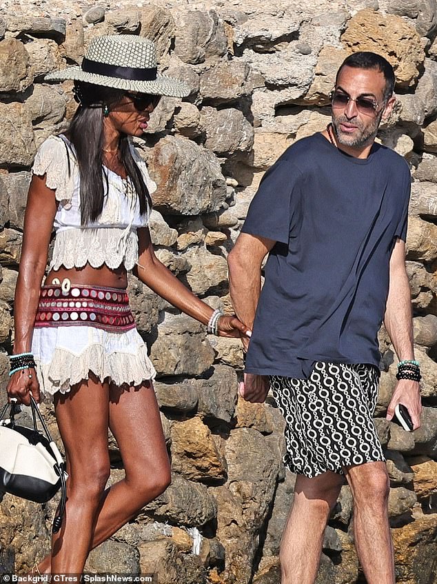 The supermodel, 54, appeared in great spirits while holding hands with the film producer, 38, as the couple continued to fuel their romance rumours