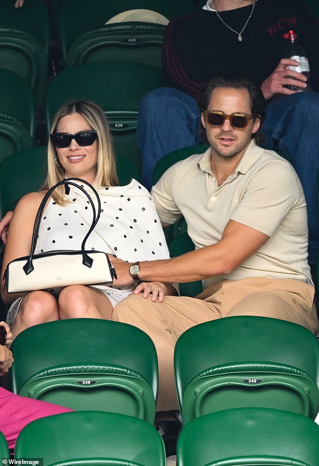 The couple were seen in the crowd at Wimbledon last month as Tom placed a hand on Margot's bump