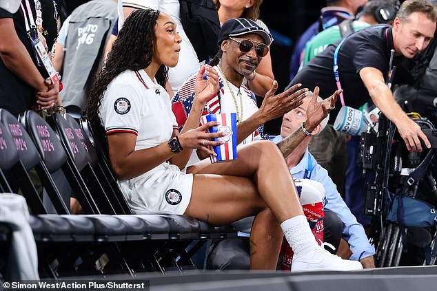 Snoop - real name Calvin Cordozar Broadus Jr. - looked to be thoroughly enjoying the game, with the hitmaker seen clapping and cheering in support of the players