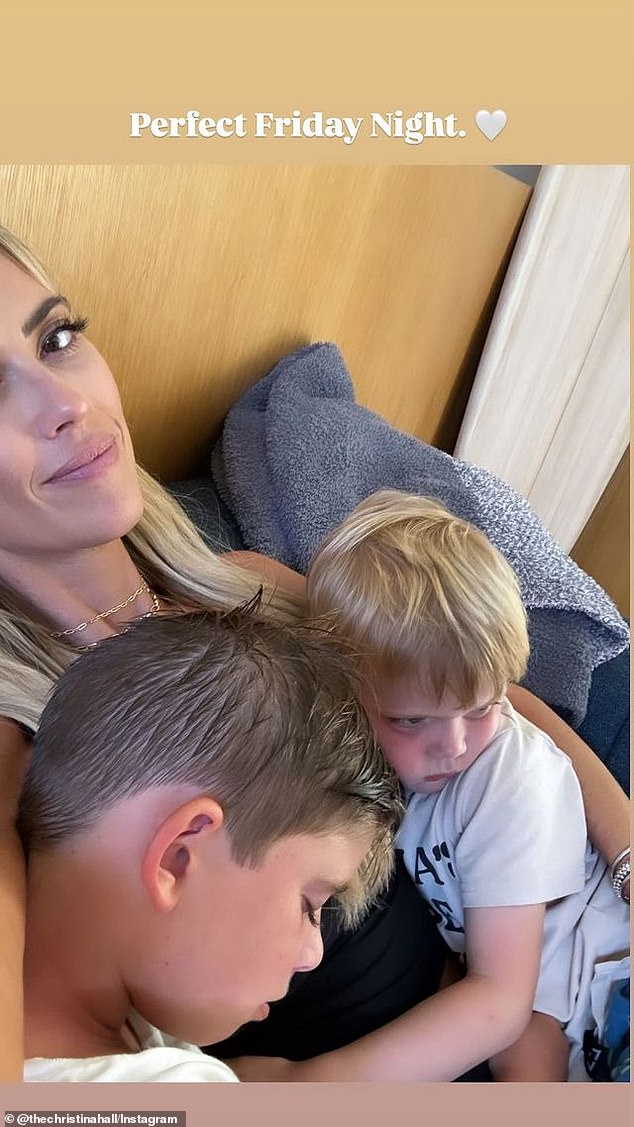 Later in the evening, she uploaded a sweet snap of herself cuddling on the couch with her sons Brayden, eight, and four-year-old Hudson